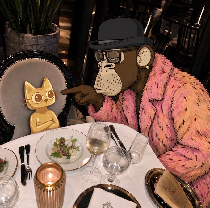 A sharply dressed cartoon gorilla in a pink fur coat, black bowler hat, and sunglasses sits at a fancy candlelit restaurant table, pointing accusingly at a smug-looking yellow cartoon cat in a chair across from him, perfectly illustrating the post's "Did you sell? No, I bought more…" meme about stubborn investors refusing to take profits.