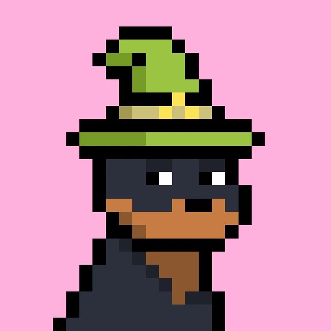 A pixel art image of a character resembling an Inkling from Splatoon with an orange beard, wearing a green military-style hat on a pink background.