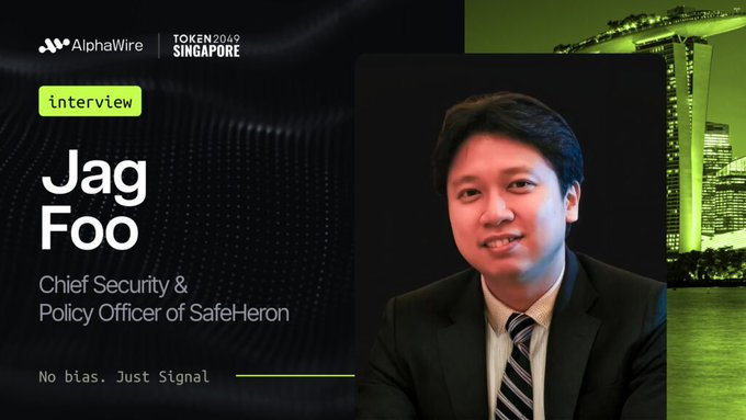 An interview thumbnail featuring Jag Foo, Chief Security & Policy Officer of Safe-Heron, for AlphaWire at TOKEN2049 Singapore, with the tagline 'No bias. Just Signal'.