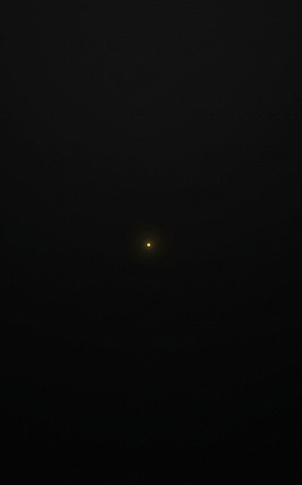 A single glowing point of light shines in the darkness, symbolizing a new beginning emerging from the unknown. The lone star-like glow embodies the post's message of an impending fresh start or chapter yet to unfold.