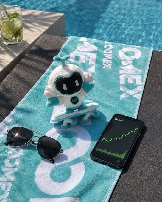 A plush toy rides a small skateboard on a teal "ONEX COMEX" towel beside a phone displaying green BTC candlestick charts, mirroring the caption's "crypto buddy enjoying the green candles" as the toy celebrates the upward price movement poolside with sunglasses and a refreshing lime drink nearby.
