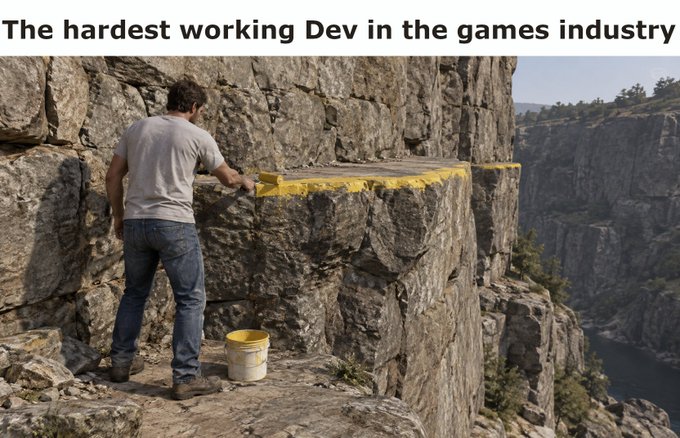 A meme captioned "The hardest working Dev in the games industry" showing a man painting the edge of a cliff yellow.