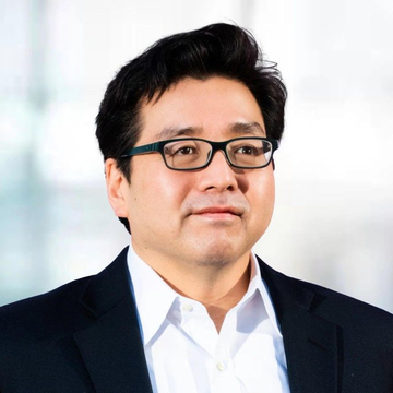 A headshot of Tom Lee, the well-known financial analyst, wearing black-framed glasses, a dark blazer, and white shirt, paired with a post noting his commentary that $ETH is outperforming after a softer CPI print, supporting the view of Ethereum as a form of money.