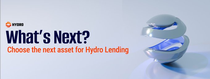 A promotional banner from Hydro Lending featuring the "What's Next?" headline with the tagline "Choose the next asset for Hydro Lending," accompanied by a futuristic 3D spiral sculpture design, encouraging community members to suggest new assets to be added to their lending platform.