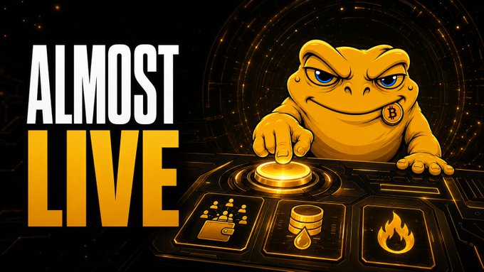 A promotional graphic with 'ALMOST LIVE' text, featuring a yellow frog mascot with a Bitcoin 'B' earring pressing a glowing button, surrounded by icons for chess, coins, and fire.