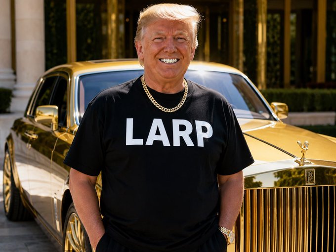 The image features a man wearing a black t-shirt with white text that reads "LARP" standing next to a luxury gold car, possibly a Rolls Royce or a similar high-end vehicle. The man appears to be smiling for the camera while they both stand near the fancy car, emphasizing its importance in the scene.