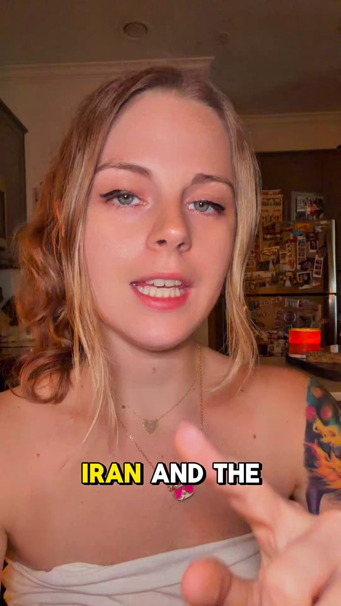 The image features a woman with blonde hair wearing a white shirt, pointing at something or someone in front of her. The caption below the photo reads "ON TODAYS BRAIN ROT NEWS" which suggests that there might be some interesting or unusual news happening today. The image also includes text about Bitcoin and US Iran relations, possibly indicating an ongoing discussion or event related to these topics.
