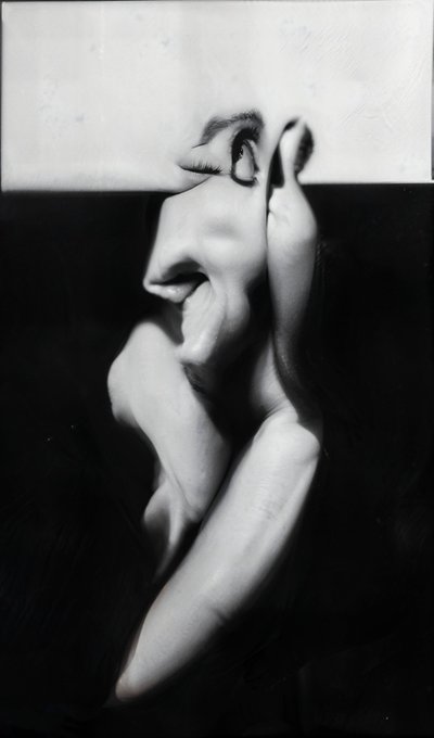 This black-and-white image depicts a surrealist photographic composition of a distorted human figure, with an eye and hand emerging from fragmented facial and body forms against a dark background, evoking the disorienting, dreamlike aesthetic characteristic of the "Constellation" series by verse_works.