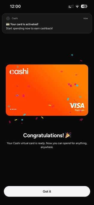 The image shows a smartphone notification and confirmation screen from the Cashi app, indicating "Your card is activated!" and displaying an orange Cash Visa Platinum virtual card with a "Congratulations!" message confirming the card is ready for spending. 

This relates to the post by demonstrating that the user has successfully activated their Cashi card, which the post suggests is an alternative to Binance, likely for users whose Binance cards were revoked—possibly in connection with prior Axie Infinity activity mentioned in the post.