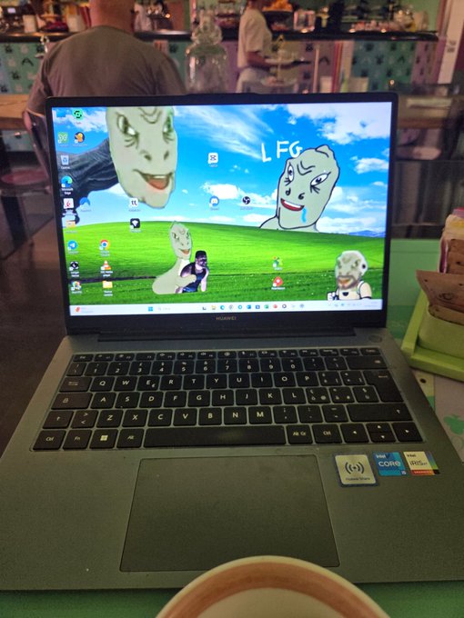 A Huawei laptop displays a Windows desktop wallpaper featuring characters from Rick and Morty alongside the text "LFG," set in a café setting. The caption's playful reference to "yeethereum" and "$YEE" appears to mirror the meme-style enthusiasm shown by the "LFG" text on screen, capturing the excitement of the crypto community.