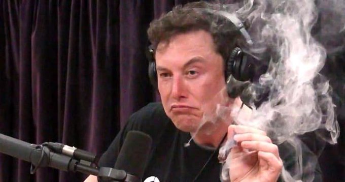 A man wearing headphones sits in front of a microphone while smoking, with smoke visible around his face.

The image appears to be a meme of Elon Musk smoking, used to humorously illustrate the post's reference to Musk's market-moving tweet and its impact on Polymarket prediction odds.