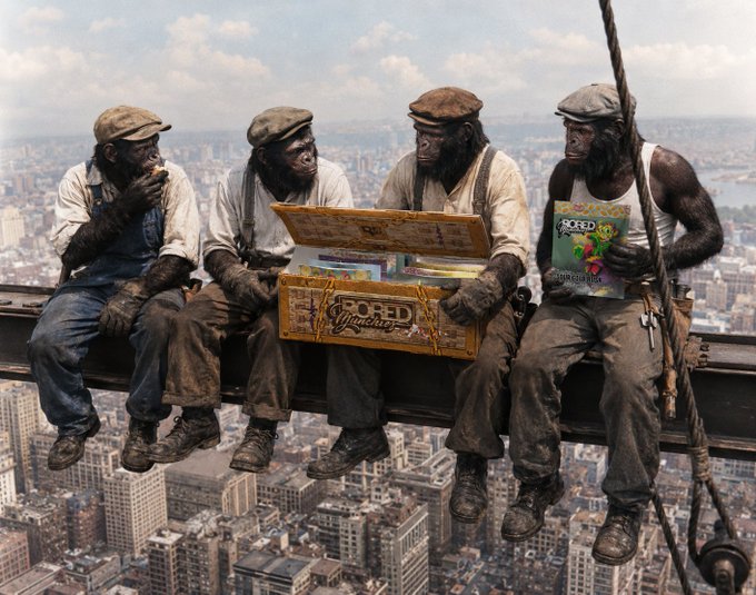 A recreation of 'Lunch Atop a Skyscraper' featuring four chimpanzees dressed as construction workers sitting on a steel beam high above a city, with one holding a 'BORED MUNCHERS' comic.