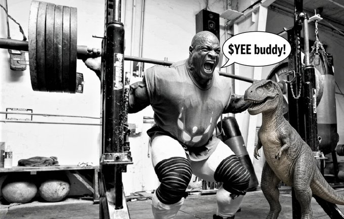 A black-and-white edited photo shows a man lifting heavy weights with a dinosaur beside him, with a speech bubble reading '$YEE buddy!'.