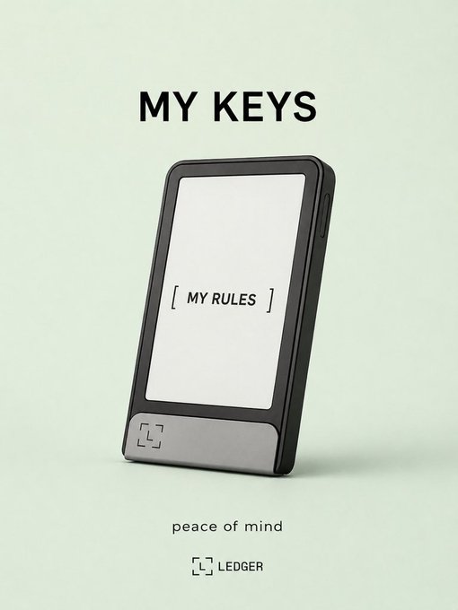 A Ledger hardware wallet device displays 'MY RULES' on its screen, with text above reading 'MY KEYS' and below 'peace of mind' along with the 'LEDGER' logo.