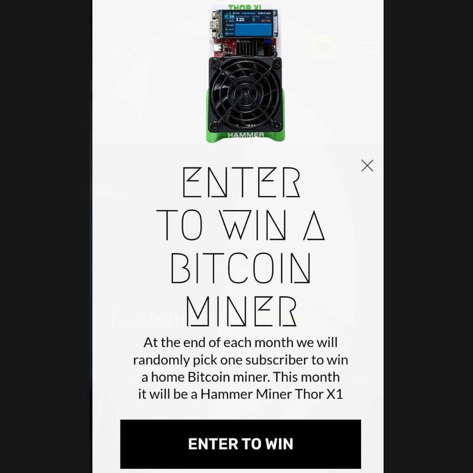 A promotional graphic for a Bitcoin miner giveaway featuring a Hammer Miner Thor X1 device, with text reading 'ENTER TO WIN A BITCOIN MINER' and a black 'ENTER TO WIN' button.