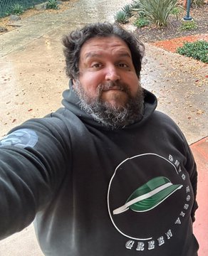 A bearded man takes a selfie wearing a hoodie that reads "PLANET APE" with a graphic of a planet, playing on the post's joke by humorously presenting himself as "the ape" in the comparison.