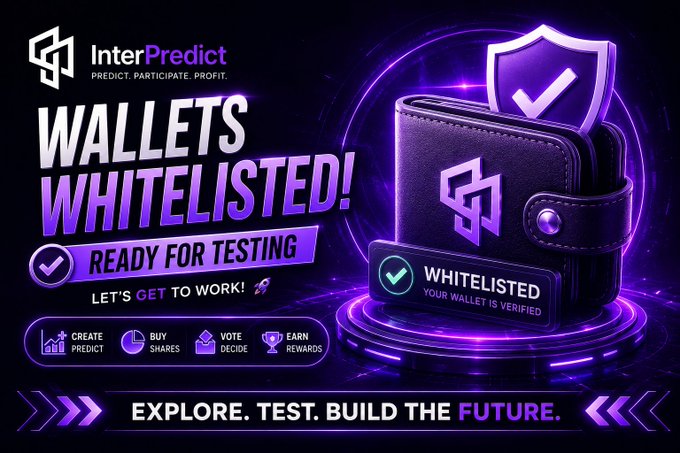 A purple-themed promotional banner for 'InterPredict' announcing 'WALLETS WHITELISTED! READY FOR TESTING' with a shield icon and call-to-action 'EXPLORE. TEST. BUILD THE FUTURE.'