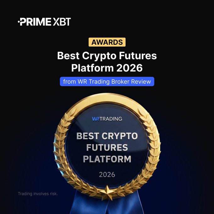 A promotional award graphic featuring the PrimeXBT logo and a golden laurel-wreathed badge on a black background, displaying text that reads "AWARDS - Best Crypto Futures Platform 2026 - from WR Trading Broker Review" along with "WR TRADING - BEST CRYPTO FUTURES PLATFORM 2026" on the medallion and a disclaimer "Trading involves risk" at the bottom, visually celebrating PrimeXBT's recognition as the Best Crypto Futures Platform 2026 from WR Trading.