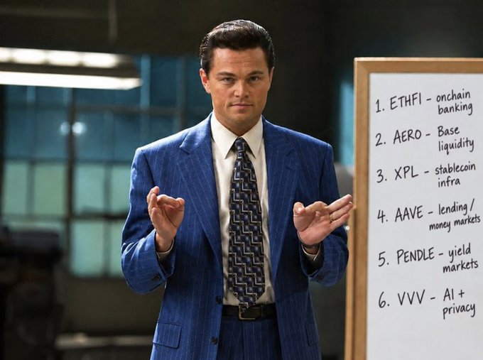 Leonardo DiCaprio as Jordan Belfort from The Wolf of Wall Street stands in a blue pinstripe suit next to a whiteboard listing crypto tokens: ETHFI (onchain banking), AERO (Base liquidity), XPL (stablecoin infra), AAVE (lending/money markets), PENDLE (yield markets), and VVV (AI + privacy).