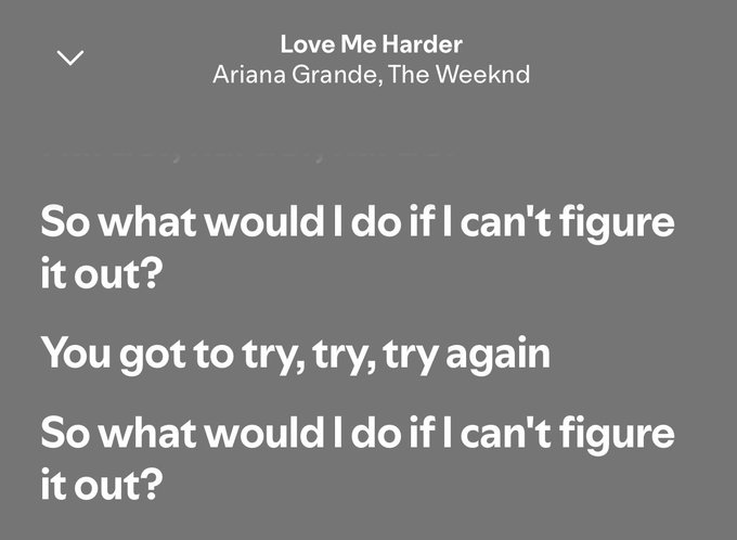 A grey music player screen displaying lyrics from "Love Me Harder" by Ariana Grande and The Weeknd, featuring the lines "So what would I do if I can't figure it out? You got to try, try, try again."