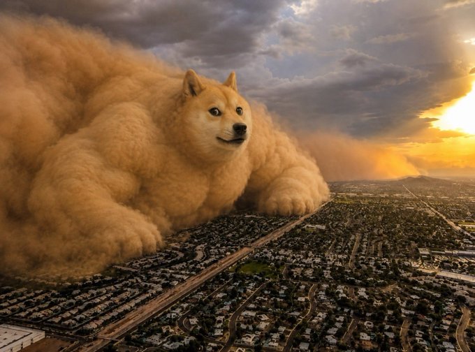 A dramatic, large-scale image of a giant fluffy dog (resembling a Shiba Inu or Corgi) lying above a sprawling suburban landscape at sunset, surrounded by dust clouds.