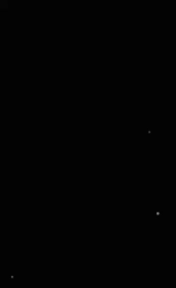 The image features a black square with white dots, which appears to be a sticker or label placed on top of it. The background color of the image is gray, providing contrast to the black square with white dots. The caption below the image reads "The Long Drift for Sequence 007 A fully onchain piano piece". This text seems to be related to the image's content and could possibly be a reference or description of the sticker placed on the black square.