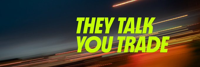 The image features bold neon-yellow text reading "THEY TALK YOU TRADE" over a motion-blurred nighttime road with streaks of red and white light, conveying speed and action. This aligns with the post's theme of taking control of your crypto assets through DeFi—moving beyond passive holding to actively borrowing, lending, and trading, just like the fast-moving streaks of light suggest momentum and forward progress.