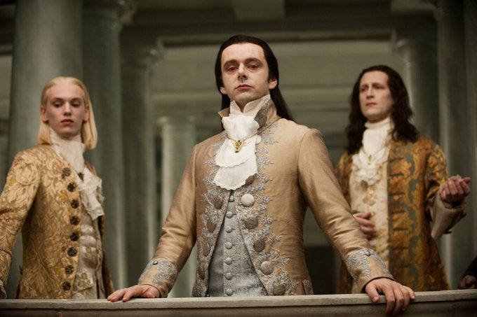 Three pale, elegantly dressed vampires in ornate 18th-century attire stand regally behind a balustrade, with the central figure in a cream brocade coat and lace cravat exuding aristocratic authority.

The image of high-society vampires clinging to old-world power and wealth humorously mirrors the post's jest about clinging to a tiny BTC portfolio across multiple legal jurisdictions, suggesting crypto holders resemble the undead nobility—immortal, aristocratic, and absurdly protective of their (questionably valuable) ancestral holdings.