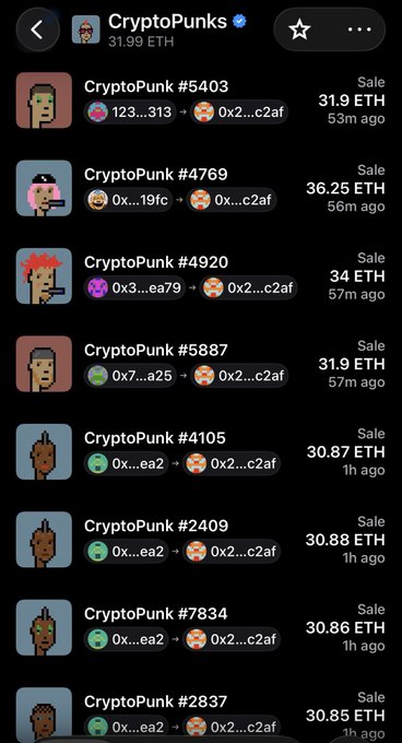 In a photo-based description of the Crypt Punk website on a smartphone screen, there are multiple rows of icons representing various items available for sale on the site. The phone's camera appears to have captured these details when the photo was taken. One of the icons stands out due to its red color and size, possibly indicating an item or feature of interest. The image provides a snapshot of the website layout, capturing both the visual aspects and the user experience associated with Crypt Punk's marketplace for punks and others who are interested in these items.