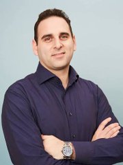 A professional headshot of Michael Weisz, who has been appointed as the new CEO of Kamino, Solana's leading lending protocol, with the image likely being his official portrait accompanying the announcement of his new role leading institutional growth and US expansion, leveraging his background as Yieldstreet co-founder where he helped facilitate over $6 billion in investments across private markets.
