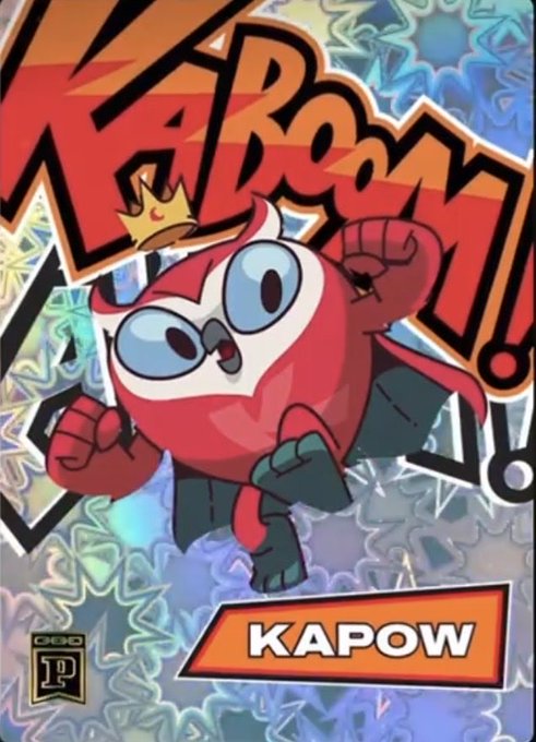 A holographic-style trading card featuring a red cartoon character wearing a crown, with 'KAPOW!' text and the Capcom logo visible.