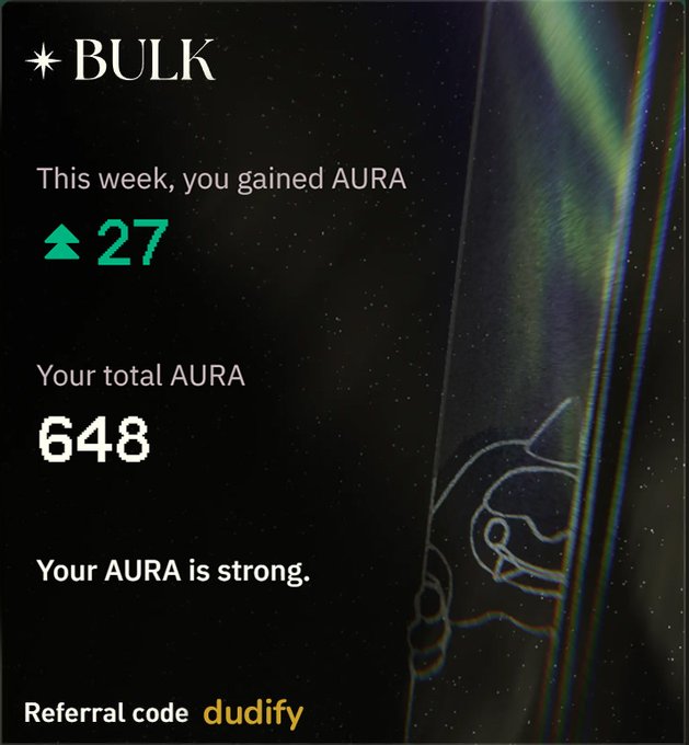 The image shows a poster with an advertisement for a product or service related to the aura distribution day of Saturday. The poster features a black background, which contrasts with the green text that reads "This week, you gained Aura". Below this information, there is a reference code in yellow and a message about referring someone to the product or service.