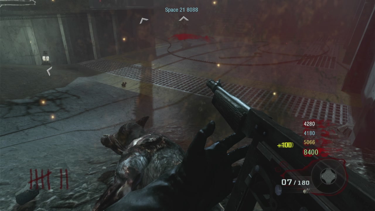 The image features a player with black gloves, holding an M4 carbine while engaged in combat within a game. The player's weapon appears to be malfunctioning, as evidenced by the gun firing multiple shots at once. A red target can also be seen, and there is a small white text object that reads "212 $BTC  $CRO  $SOL  $BASE  $PACK  $CAW WOLFIES PLAYING BLACK OPS ZOMBIES". This suggests the player's weapon is not working properly in this game and they are dealing with issues due to a malfunction.