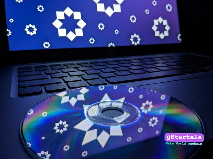 A close-up of a laptop keyboard with a CD resting on it, both displaying a star-like logo pattern, with text reading 'gStartale Make World Onchain'.