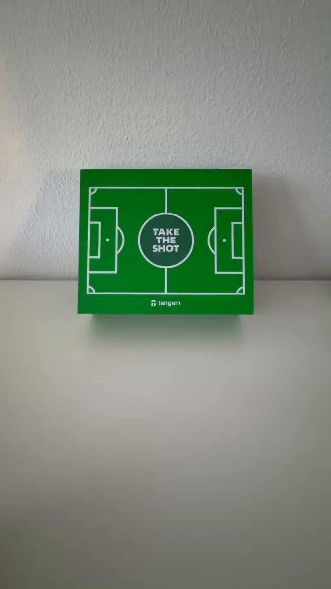 The image features a green soccer field with white lines that say "Take It or Leave It" written on them. The scene takes place against a white background, which highlights the vibrant colors of the soccer field. There are no other objects present in the image, and the focus is solely on the soccer field and its message.