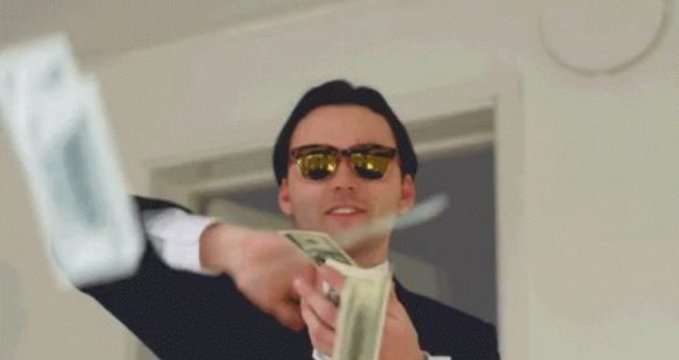 A man in dark sunglasses and a suit jacket is joyfully tossing stacks of cash into the air inside a room, perfectly capturing the celebratory "making money" sentiment of the post with the implied call to action to "claim it."