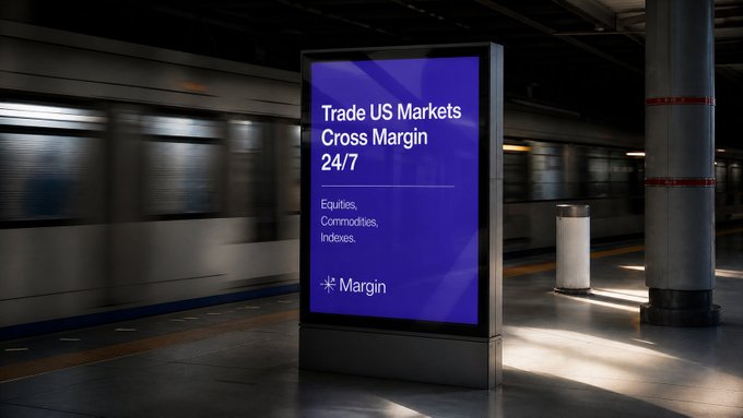 An advertisement for Margin, a Solana-based perpetuals exchange, displayed on a digital billboard in a subway station. The ad promotes "Trade US Markets Cross Margin 24/7" for "Equities, Commodities, Indexes" with the Margin logo, visually echoing the post's introduction of Margin as a trading platform offering around-the-clock market access.