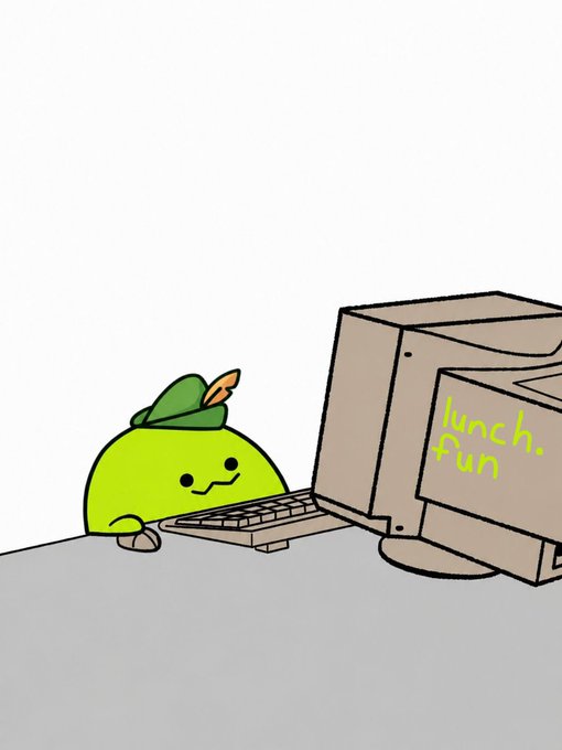 A cute green blob character wearing a leaf hat sits at a keyboard next to a cardboard computer labeled 'lunch pun' in green marker.