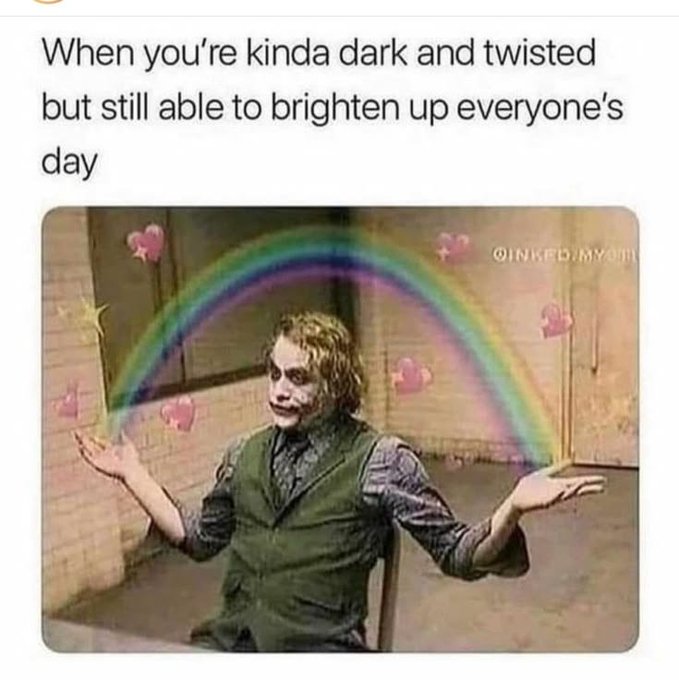 A humorous meme featuring the Joker character with his arms outstretched, edited with a rainbow and pink hearts, captioned 'When you're kinda dark and twisted but still able to brighten up everyone's day' with watermark '@INKEDJMYOU'.