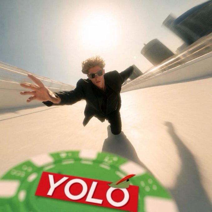 A scene showing a man in a black suit and sunglasses diving through the air against a city skyline background, reaching toward green casino chips that read 'YOLO' in red.