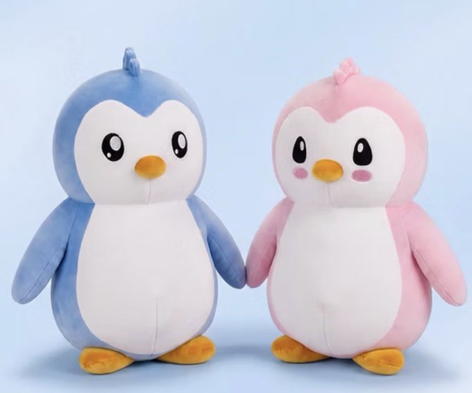 Two plush penguin toys, one blue and one pink, stand side by side holding hands against a light blue background.