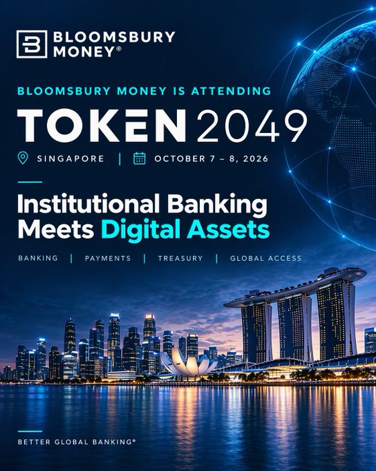 A promotional graphic for 'BLOOMSBURY MONEY' attending TOKEN 2049 in Singapore on October 7-8, 2026, featuring the tagline 'Institutional Banking Meets Digital Assets' over a nighttime cityscape.