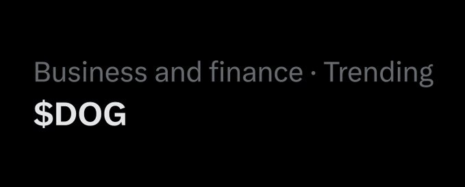 The image displays "$DOG" as a trending topic under "Business and finance," visually confirming the post's announcement that the ticker $DOG is trending on X (formerly Twitter).