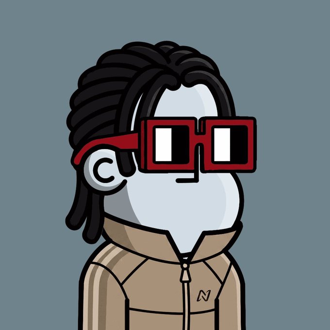 A cartoon illustration of a character with dreadlocks, red 3D-style glasses, and a tan track jacket with an 'N' logo on a blue-gray background.