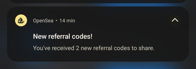 OpenSea mobile app notification announcing 'New referral codes!' stating the user has received 2 new referral codes to share.