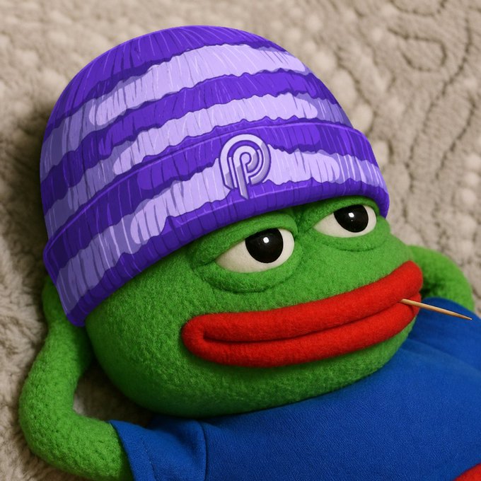 A green Pepe the Frog plushie wears a purple striped beanie featuring the Pyth Network logo, with a toothpick in its mouth—visually representing the post's announcement of embracing the @PythNetwork ecosystem before the June 30th date.