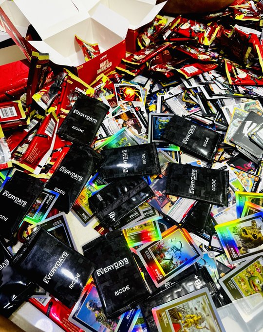 A large collection of Pokémon trading card booster packs from various sets, including "Battle Partners" and black "Everydays" packs, sits in piles alongside numerous opened card packs with holographic cards scattered throughout. The image's massive quantity of unopened packs and shiny pulled cards visually supports the post's sense of excitement and anticipation about ripping open more booster boxes.