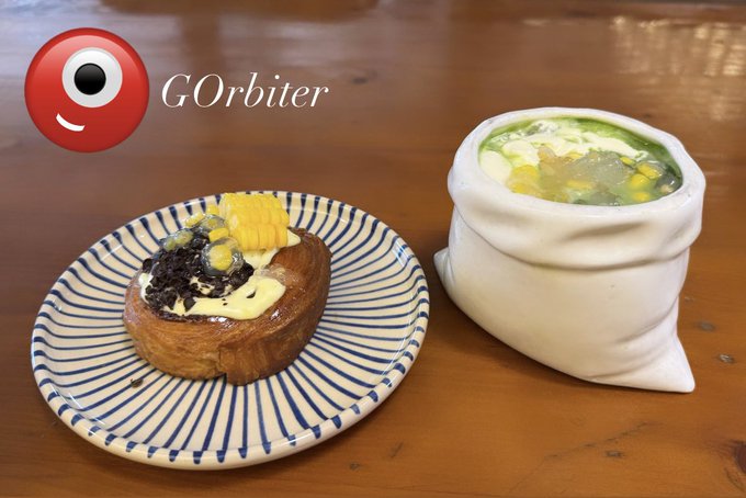 The image features a dining table with two plates of food, one containing a sandwich and the other holding a small white bag filled with food. The plate with the sandwich has a blue and white striped pattern around its edge. The accompanying text reads "@Orbiter_Finance". This suggests that the post is related to an online business or service offering financial advice for those who want to start their own business, as indicated by the name of the post.