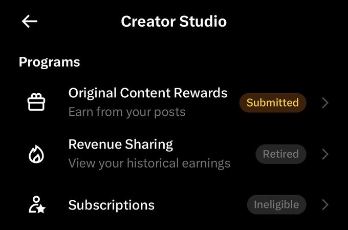 A Creator Studio mobile app screen showing Programs including Original Content Rewards (status: Submitted), Revenue Sharing (status: Retired), and Subscriptions (status: Ineligible).