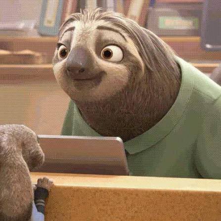 A close-up of a sloth character from the animated movie Zootopia with a friendly smile.